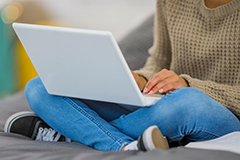 SEU student holding a laptop