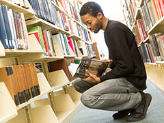 SEU political science student in the Mahoney Library